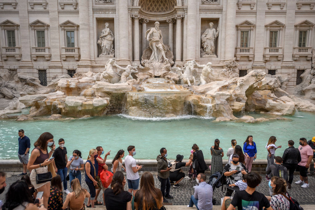 ROME, ITALY - JUNE 7: Tourists visit the Fontana di Trevi (Trevi Fountain), on June 7, 2021 in Rome, Italy. The Covid-19 incidence in Italy fell to 32 cases for every 100,000 inhabitants, down from 47 last week, according to the report of the Government's COVID task force. (Photo by Antonio Masiello/Getty Images)