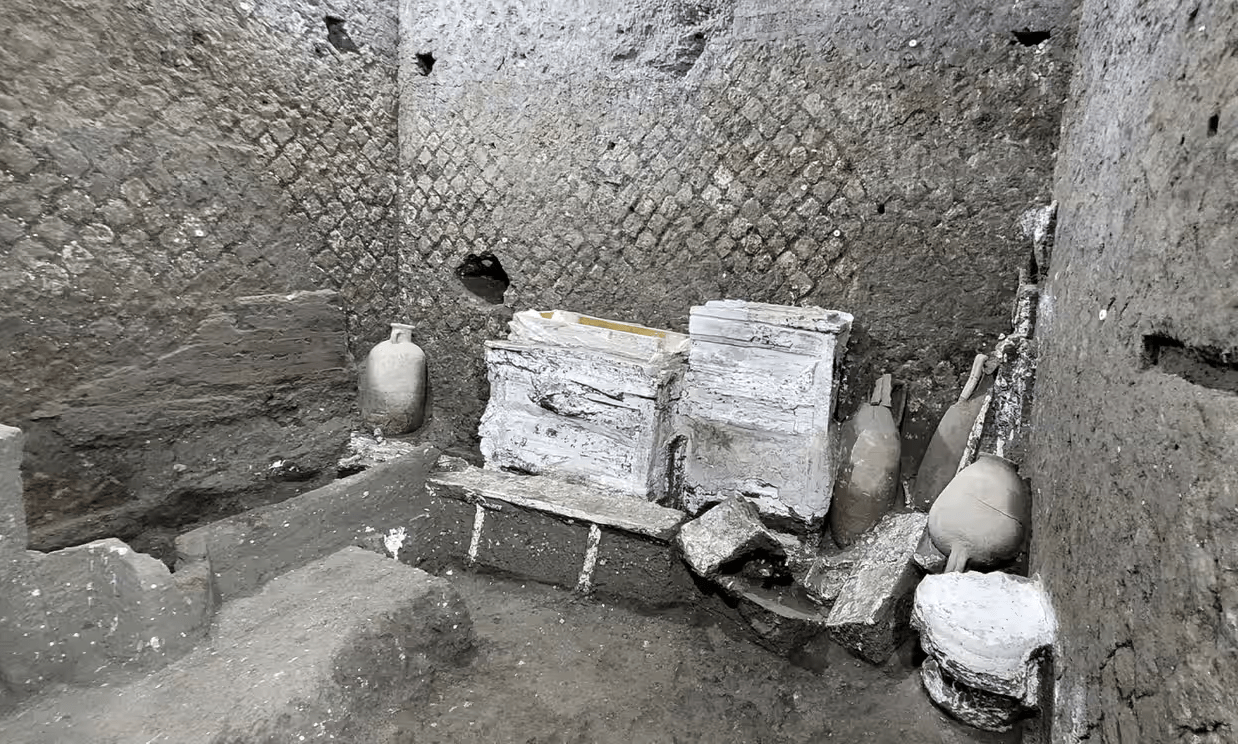 An ancient room with boxes and urns.
